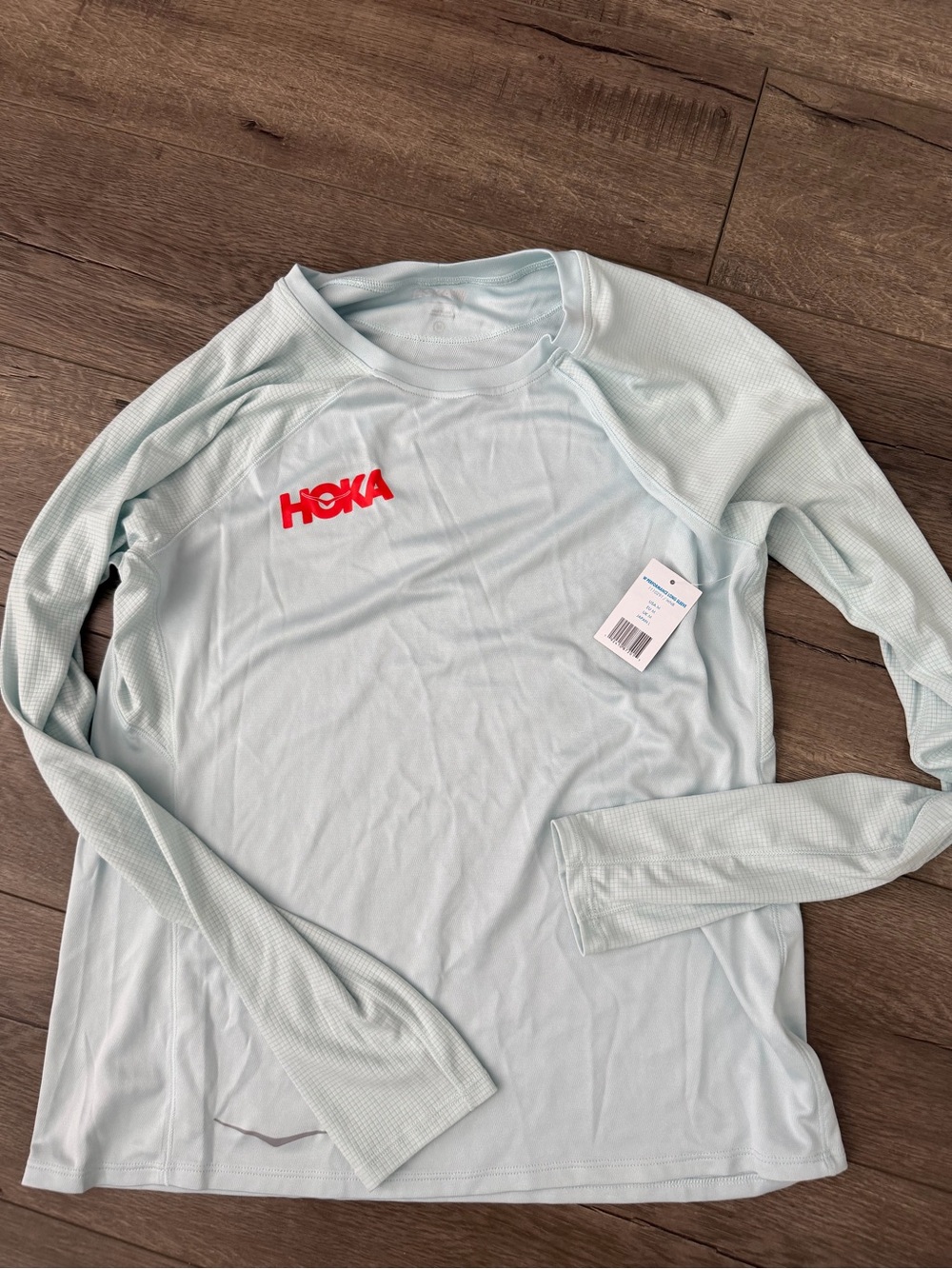 Hoka Women's Light Blue Long Sleeve Performance Tee with Red Logo size M